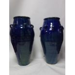 A pair of Persian blue glazed Sharab wine vessels, H.90cm (2)