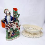 A Victorian Staffordshire figure of a hunter together with a 19th century cream ware porcelain