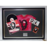 A framed Madonna record, cd and t-shirt by Warner Bros to regonise the collective sales, 76 x 110cm