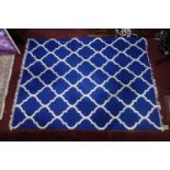 An Indian agra carpet with blue & white design, 224 x 167cm