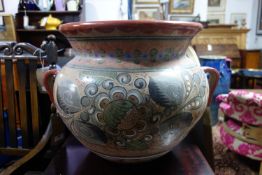 A large 20th century hand painted twin handled terracotta pot, H.42 W.60 D.48cm