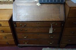 A 19th century oak bureau with four drawers raised on bracket feet, H.100 W.90 D.48cm