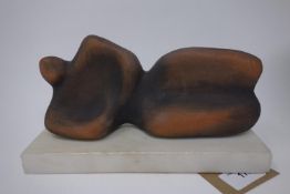 A ceramic figure after Henry Moore, on rectangular reconstitued marble base, H.11 L.22cm