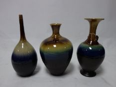 Three Persian drip glazed vases of varying form, H.36cm (tallest)