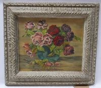 A still life study of roses in a vase, signed V Semal and dated 1936, oil on board, in distressed