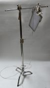 A chrome adjustable angle poise standard lamp