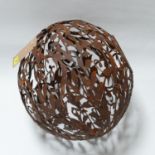 A cast metal sphere of pierced floral design, H.42cm