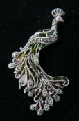 A sterling silver, marcasite and plique-à-jour enamel peacock brooch (hues of green, yellow and red)