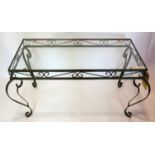 A wrought iron coffee table with glass top, H.42 W.82 D.45cm