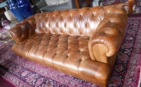 A John Lewis tan leather chesterfield sofa, H:69cm, W:214cm, D:105cm