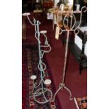 An iron candelabra, H.123cm together with one other