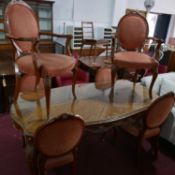 A 20th century French walnut dining table and six chairs