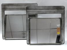 A pair of Industrial bathroom swing mirrors, H.70 W.70 D.20cm