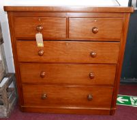 A Victorian mahogany chest, two short over three long drawers, raised on bun feet, H.112 W.110 D.