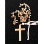 A 9ct gold chain together with a yellow metal cross