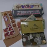 A mixed collection of coins and stamps to include a Mexican 8 reals silver coin