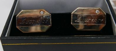 A pair of 9ct gold cufflinks set with diamonds