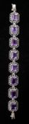 A sterling silver, amethyst and marcasite bracelet set with 8 cluster-set panels, L: 18.5cm, 28g.