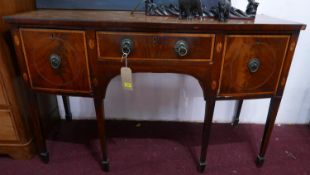 A George II mahogany bow front sideboard, with marquetry inlay, raised on tapered legs and spade