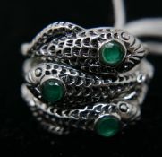 A sterling silver 3-snake ring, set with 3 round faceted emeralds within a textured coiled