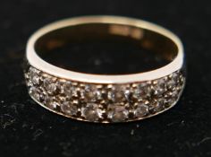 An 18ct yellow gold and diamond ring, inset with 16 diamonds, marked 750