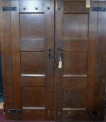 A large pair of iron bound solid oak doors, H.214 W.86 D.6cm