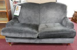 A contemporary Laura Ashley grey sofa, H.94 W.148 D.80cm