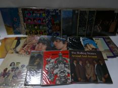 A running collection of 32 Rolling Stones vinyl record albums