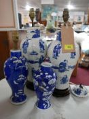 Four 19th century Chinese blue and white porcelain vases, converted to lamps