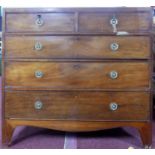 An early 19th century mahogany chest, two short over three long drawers, raised on shaped bracket