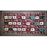 A South West Persian Qashgai kilim, repeating stylised geometric motifs with stylised geometric