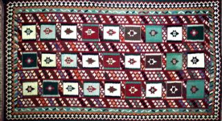 A South West Persian Qashgai kilim, repeating stylised geometric motifs with stylised geometric