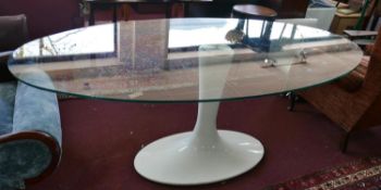 A tulip style dining table with oval glass top, H.78 W.202 D.106cm