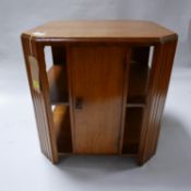An Art Deco oak low table with cupboard door, H.54 W.51 D.51cm