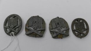 Four reproduction Third Reich Army General Assault badges, to include two badges for 50 engagements