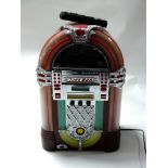 A novelty CD player in the form of a juke box