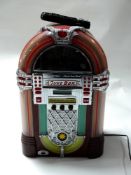 A novelty CD player in the form of a juke box