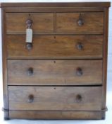 A Victorian mahogany chest, two short over three long drawers, raised on bun feet, H.111 W.99 D.47cm