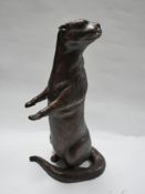 A cast bronze otter, H.53cm