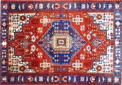 A North West Persian Nahawand rug, central diamond medallion with repeating geometric motifs on a