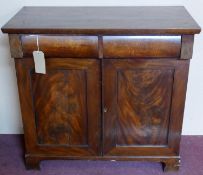 An early 19th century mahogany Chiffonier, two drawers over two cupboard doors, raised on bracket