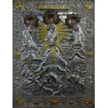A Russian white metal icon, the oklad depicting Jesus flanked by two saints, parcel gilded and