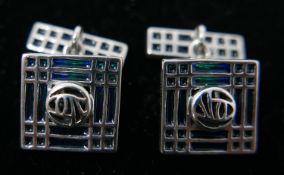 A pair of sterling silver and blue/green enamel cufflinks in the Glasgow style, Gross: 12.4g.