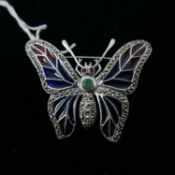 A large sterling silver butterfly brooch, set with marcasites, plique-à-jour enamel wings, emerald