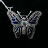 A large sterling silver butterfly brooch, set with marcasites, plique-à-jour enamel wings, emerald