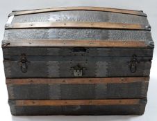 An antique iron bound faux crocodile skin dome top trunk, H.57 W.81 D.50cm