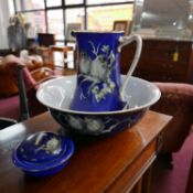 A Burslem Midwinter blue glazed jug, bowl and soap dish, decorated with birds on branches and with