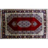 A 20th century fine silk Tabriz rug, with Mahi design on a red and blue ground, 140 x 90cm