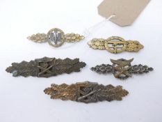 Four Third Reich clasps, to include The Day Fighter clasp, a German U-boat clasp, stamped 'Entwurf