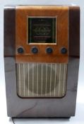 An early 20th century floor standing Bush radio in walnut case, H.83 W.51 D.28cm